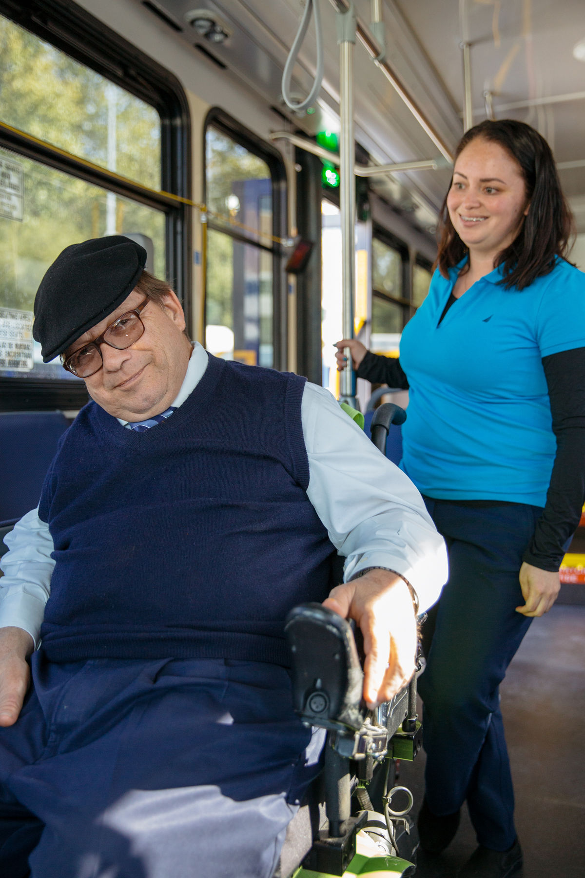 METRO employee assisting with customer in a wheelchair